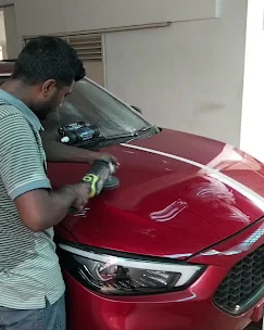 Clay bar paint decontamination process on a car in Dhaka